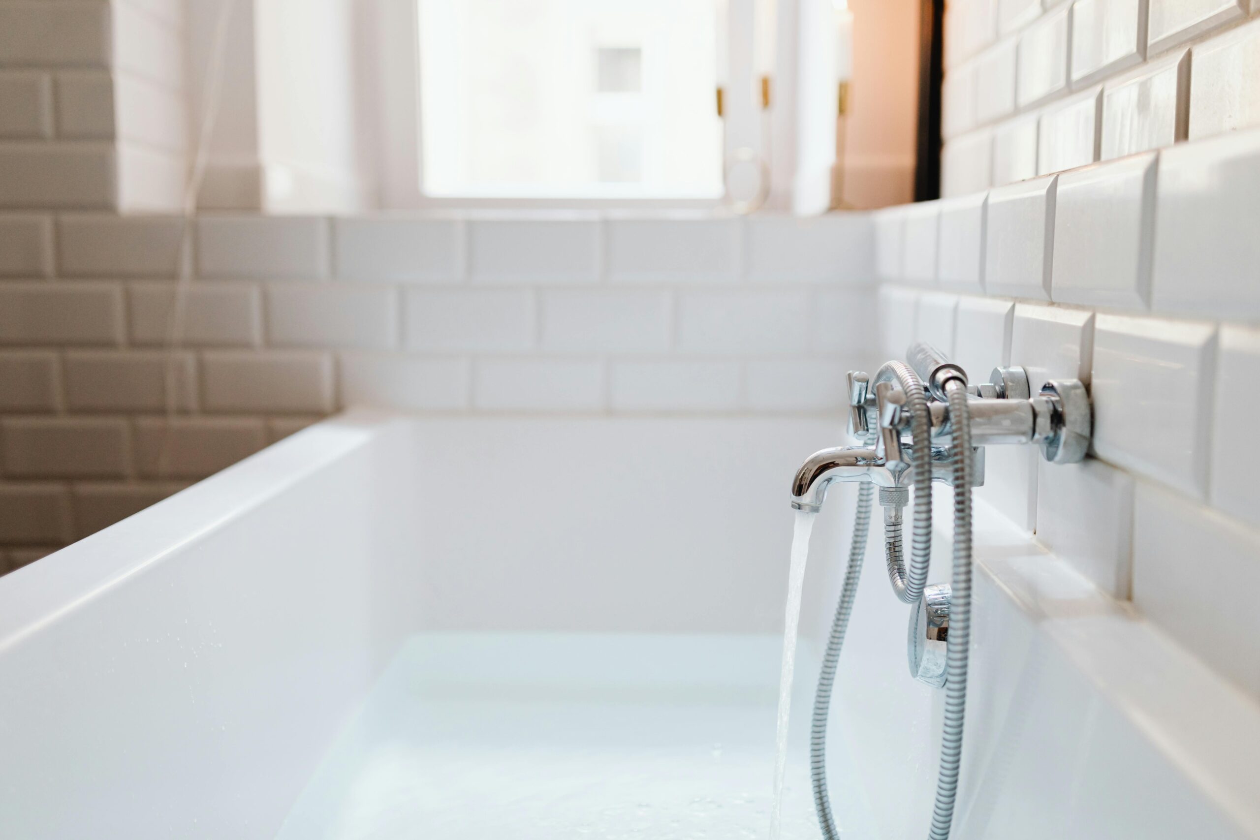 white sink with chrome faucet
