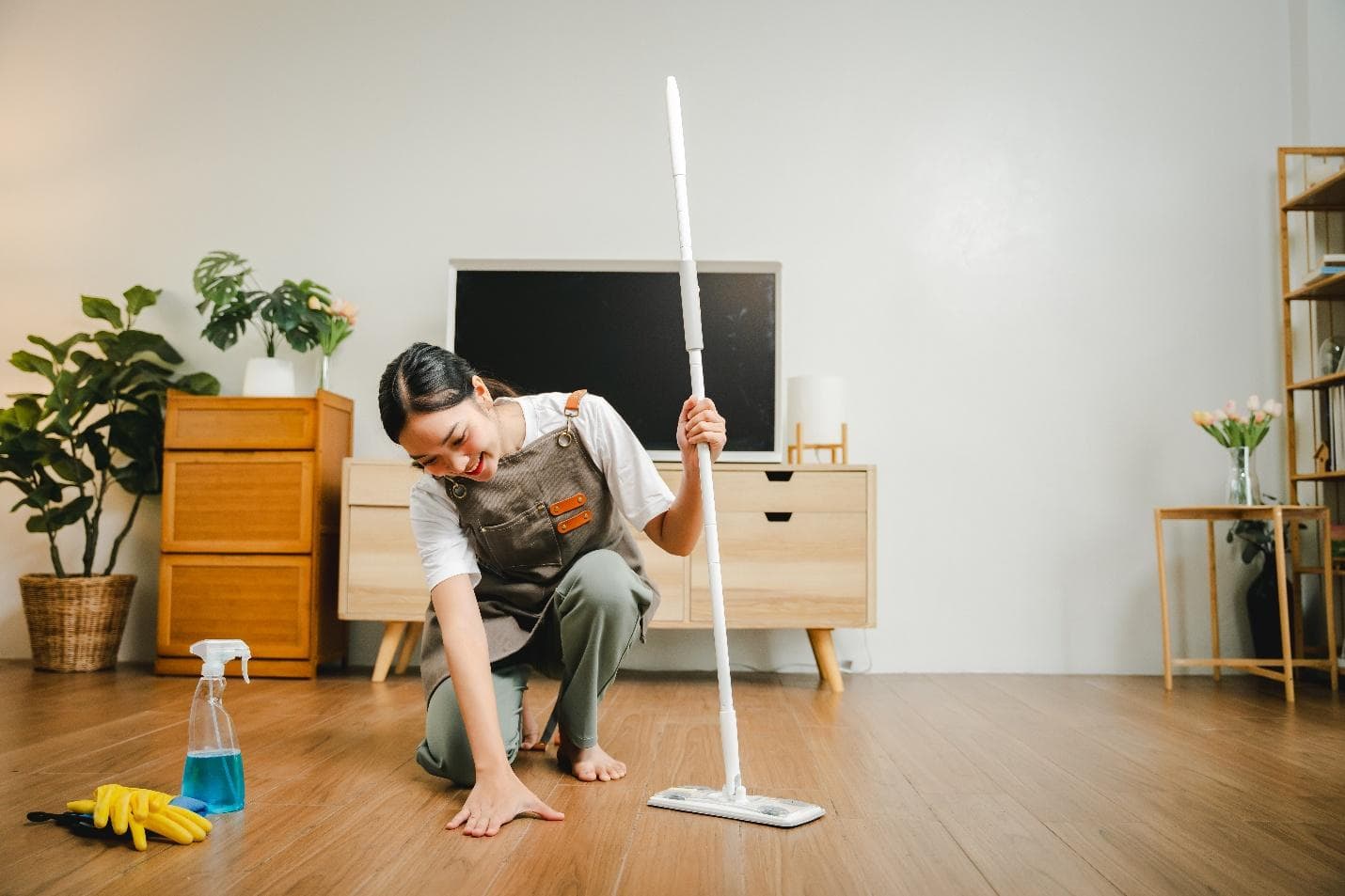 housewife cleaning and mopping the floor