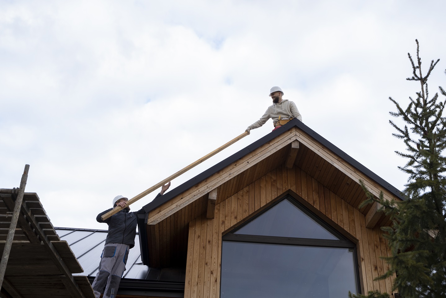 two men working on roof