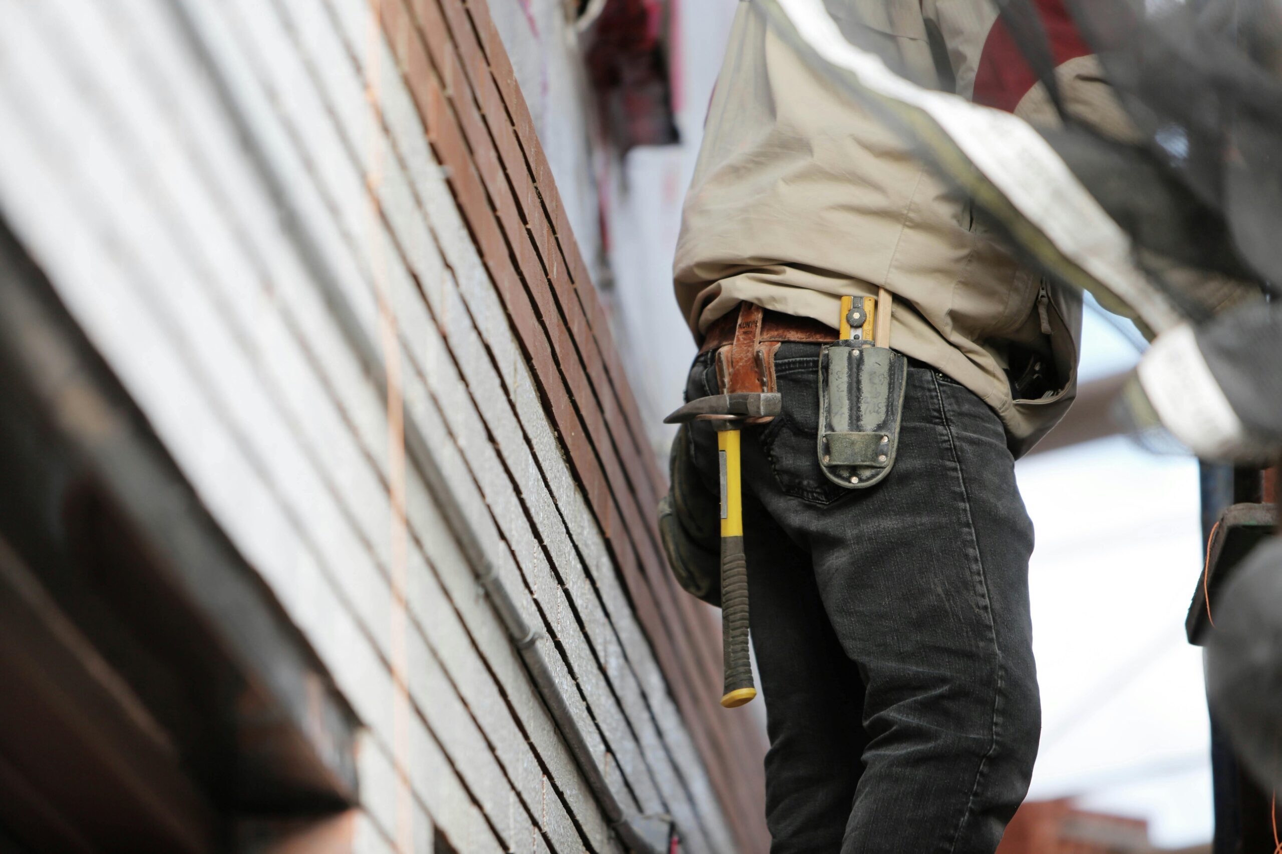 contractor wearing belt with tools contractor with tool belt