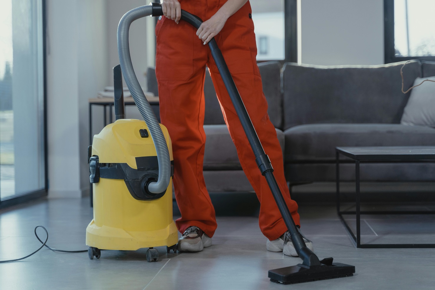 house cleaner running vacuum