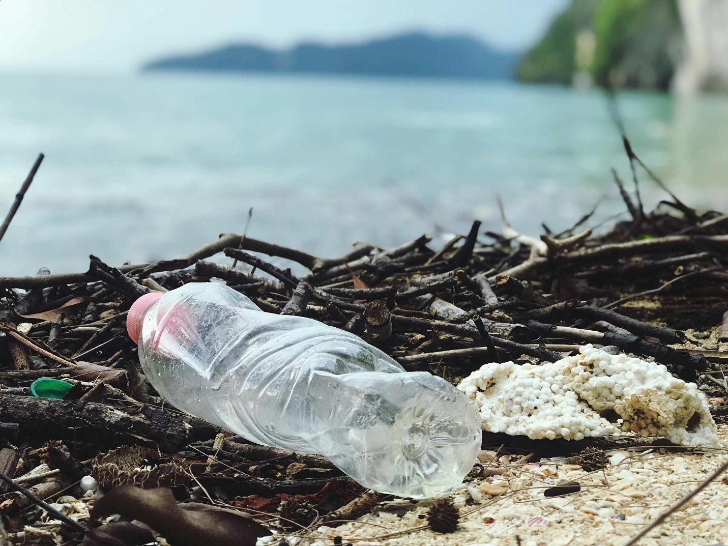 crushed water bottle on a beach